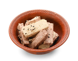 Bowl with pieces of sweet sesame halva on white background