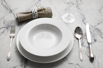 Simple dinnerware on white marble table