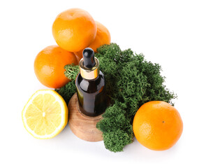 Composition with bottle of citrus serum, fruits and moss on white background