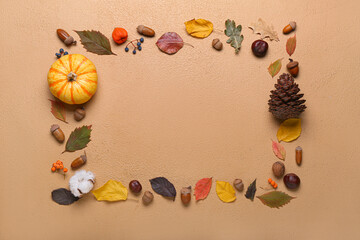 Frame made of natural forest decor on color background