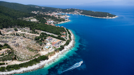 Obraz premium Drone view to boat in crystal pacific blue sea in Greece, on idyllic greek island in Ionian sea