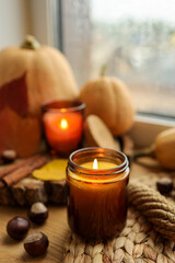 Burning candle and autumn decor, home decor aesthetics