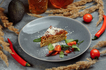 Homemade delicious Meat lasagna with basil leaf on the top. Close up. Recipe, menu. Italian cuisine. Side view