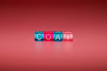 the word "coat" made up of cubes