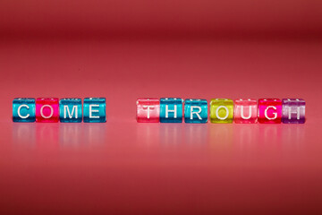 the word "come through" made up of cubes