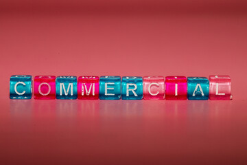 the word "commercial" made up of cubes