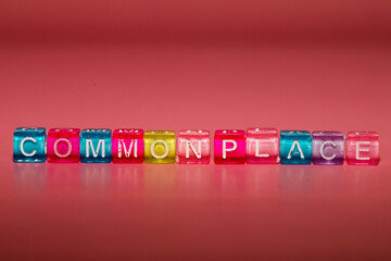 the word "commonplace" made up of cubes