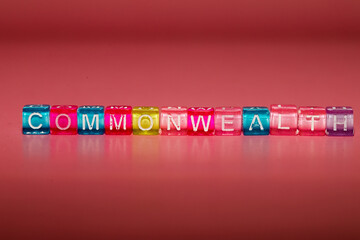 the word "commonwealth" made up of cubes