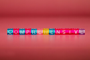 the word "comprehensive" made up of cubes