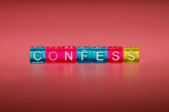 the word "confess" made up of cubes