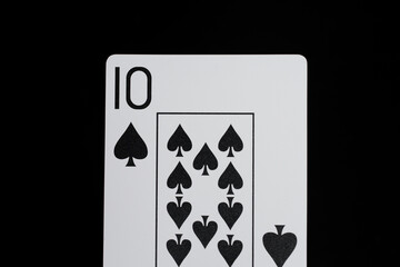 Playing cards on a black background ten