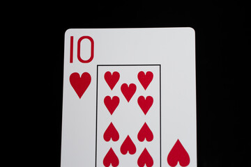 Playing cards on a black background ten