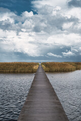 Wooden jetty over sea leading to a island in Utvalinge, Sweden. Selective focus.