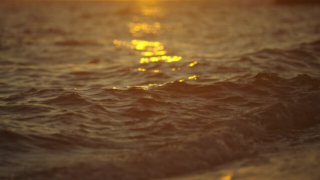 Soothing waves of sea at evening while sun reflecting on the sea water. Summer holiday background