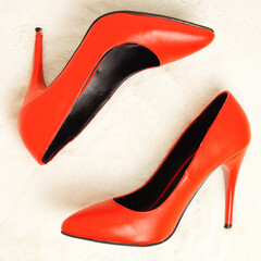 Bright red sexy shoes with stilettos. Shoes for Christmas. View from above.