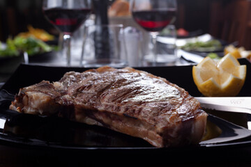 beefsteak grilled on a table of a restaurant - 532047791