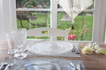 lunch set table in a bay window - 532048112