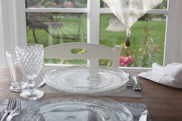 lunch set table in a bay window - 532048117