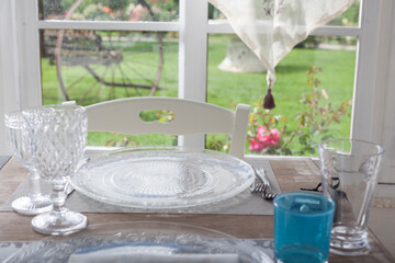 lunch set table in a bay window - 532048118