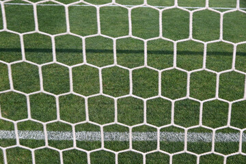Close-up goal net, details of football soccer stadium. View behind the net