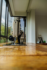 sewing machine with tread and needle in vintage mechanical steampunk machine