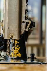 sewing machine with tread and needle in vintage mechanical steampunk machine