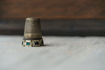 antique sewing thimble with art and ruby - obrazy, fototapety, plakaty