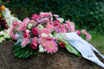 colorful Funeral Flower Arrangement on a grave after funeral
