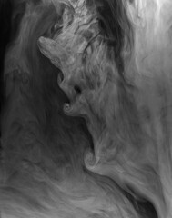 Fototapeta premium Swirling clouds of white smoke randomly mix on a black background