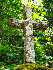Stone cross green back ground