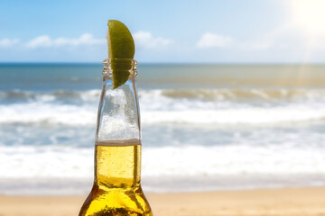 Beer with lemon and beach copyspace background
