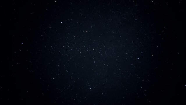 Beautiful night sky background full of stars during meteor falling. Timelapse, dolly shot. 