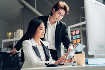 Successful business team working together in a co-working office