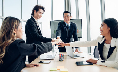 Stack of hands symbolizing trust and cooperation, Group of professional business people are working and brainstorming discussed about work in conference room.