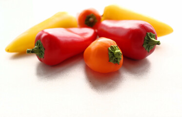 Peppers of different colors on the table, still life