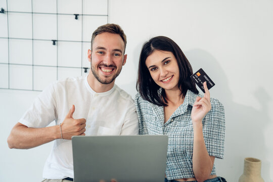 Businesspeople holding credit card and using laptop. online shopping concept.