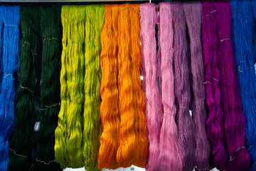 Material silk fiber and hand woven cotton thread dying with natural color hanging for show and sale...