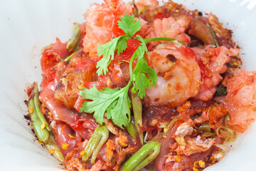 Yentafo red noodle stir fried sea food.