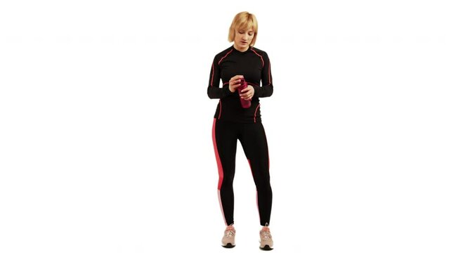 Tired Woman In Sportswear Wiped Her Sweat The Drink Water From Her Tumbler After Working Out In White Background. - full body