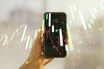 Double exposure of abstract creative financial diagram and hand with cellphone on background, banking and accounting concept