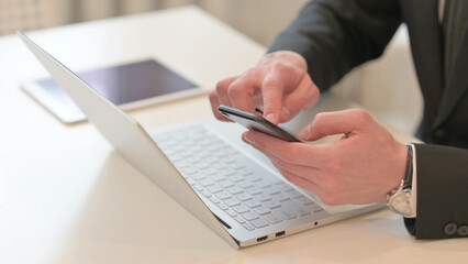 Close up of Middle Aged Businessman having Online Payment on Smartphone