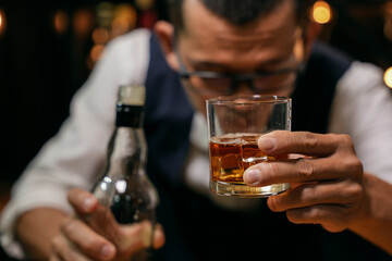 Barman pouring whiskey whiskey glass beautiful night