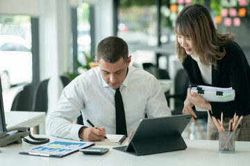 Businessman works with a team of women working together  business planning work in conference room with team