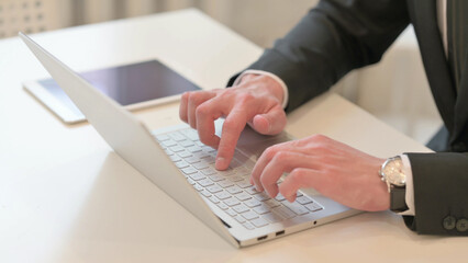 Close up of Hand of Middle Aged Businessman Using Laptop in Frustration