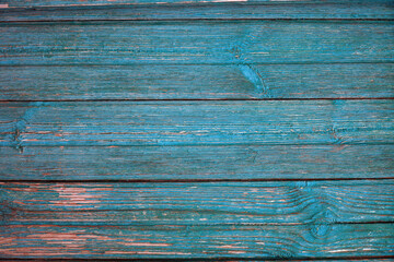 Texture of Old cracked aquamarine or celadon boards for background and design. The texture of dry wood planks