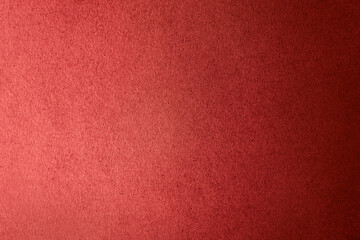 Solid dark red color gradation with light shade paint on craft recycled corrugated cardboard or...