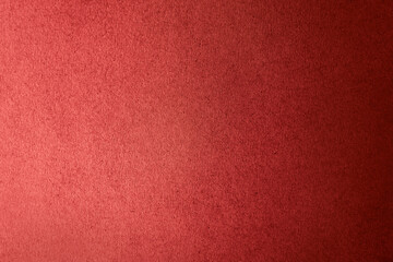 Solid dark red color gradation with light shade paint on craft recycled corrugated cardboard or fiberboard box paper texture background with space