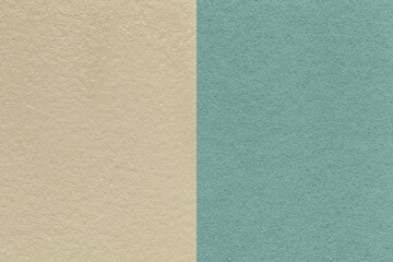Fototapeta premium Texture of craft beige and blue paper background, half two colors. Vintage brown and cerulean cardboard.