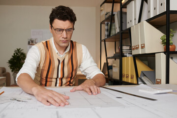 Civil Engineer Checking Blueprint