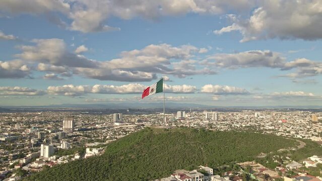 Mexico flag waving on Cerro del Obispado, Monterrey aerial view 2